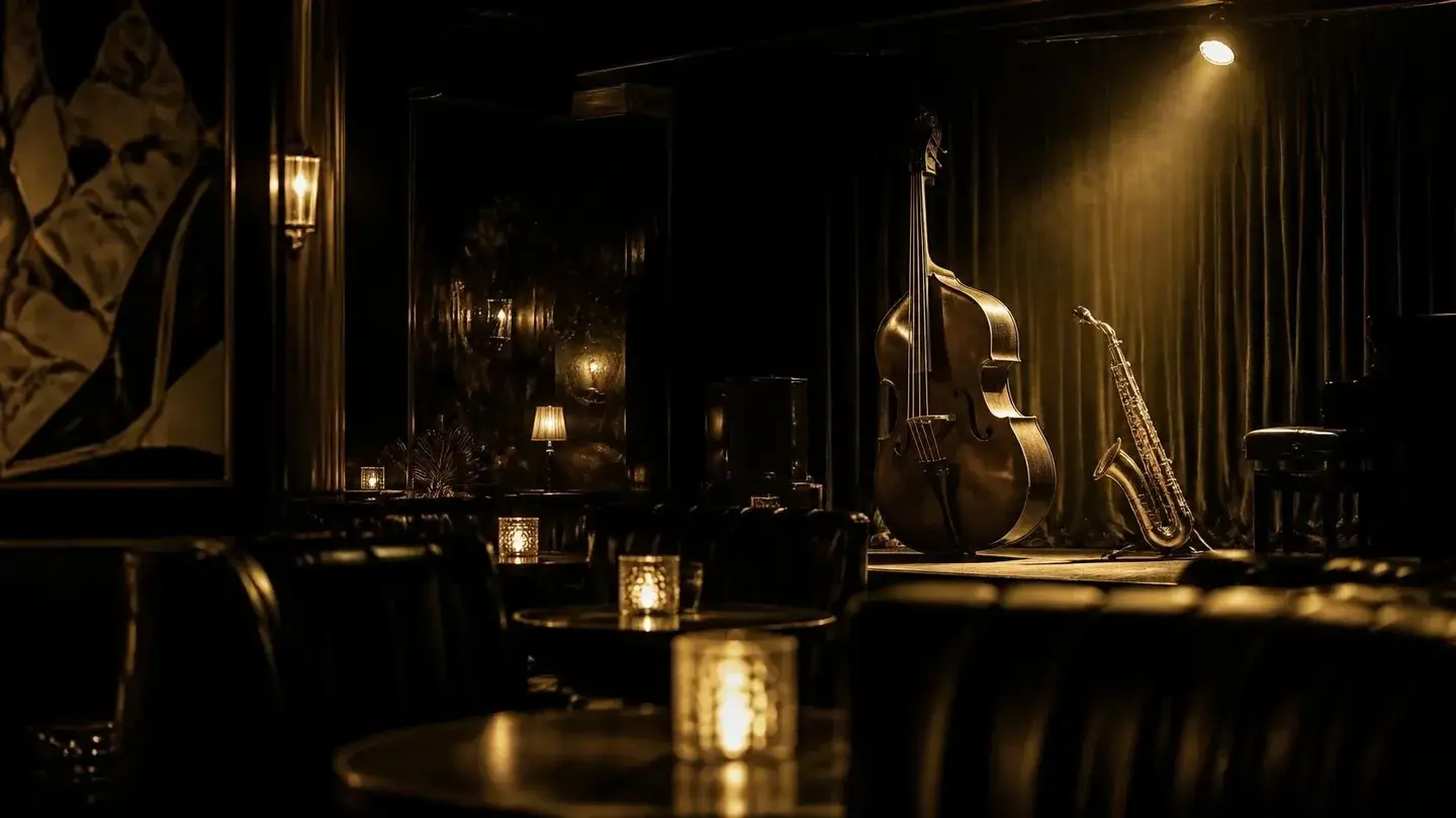 A small stage with an upright bass under a gold spotlight